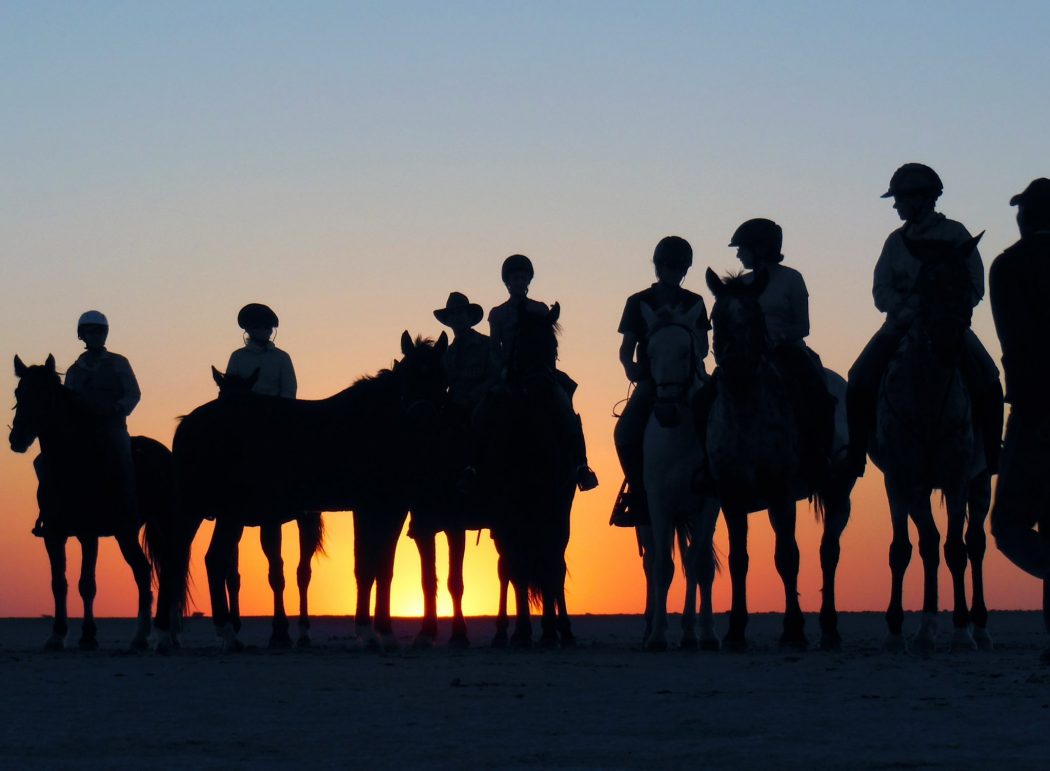 Soak in the beauty of the Kalahari desert while horseback riding in Botswana